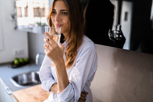 Healthy woman drinks purified water